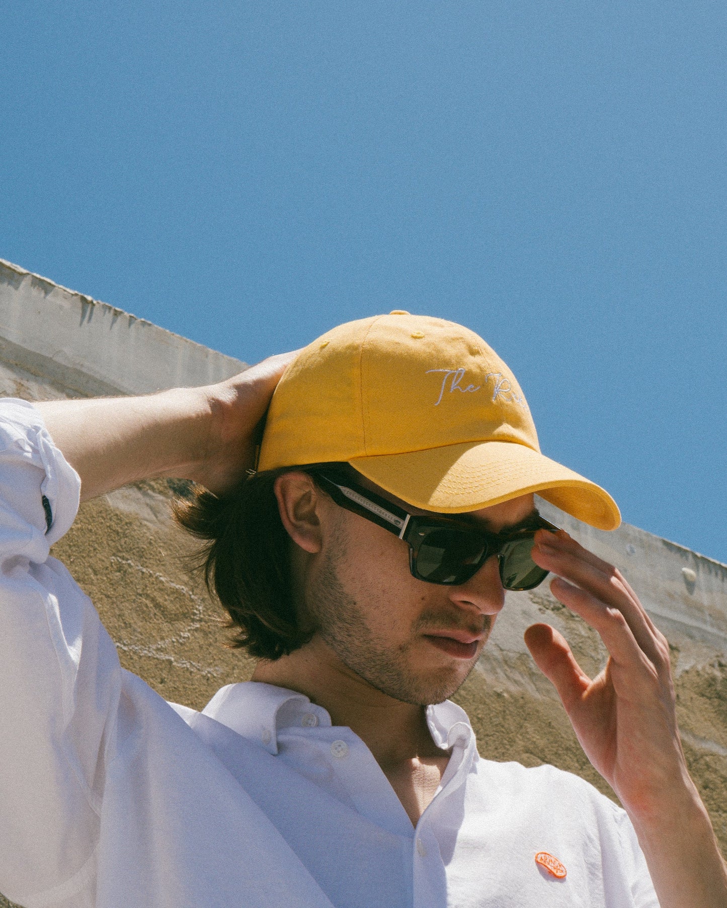 The Rake Logo Dad Cap in Amber Yellow