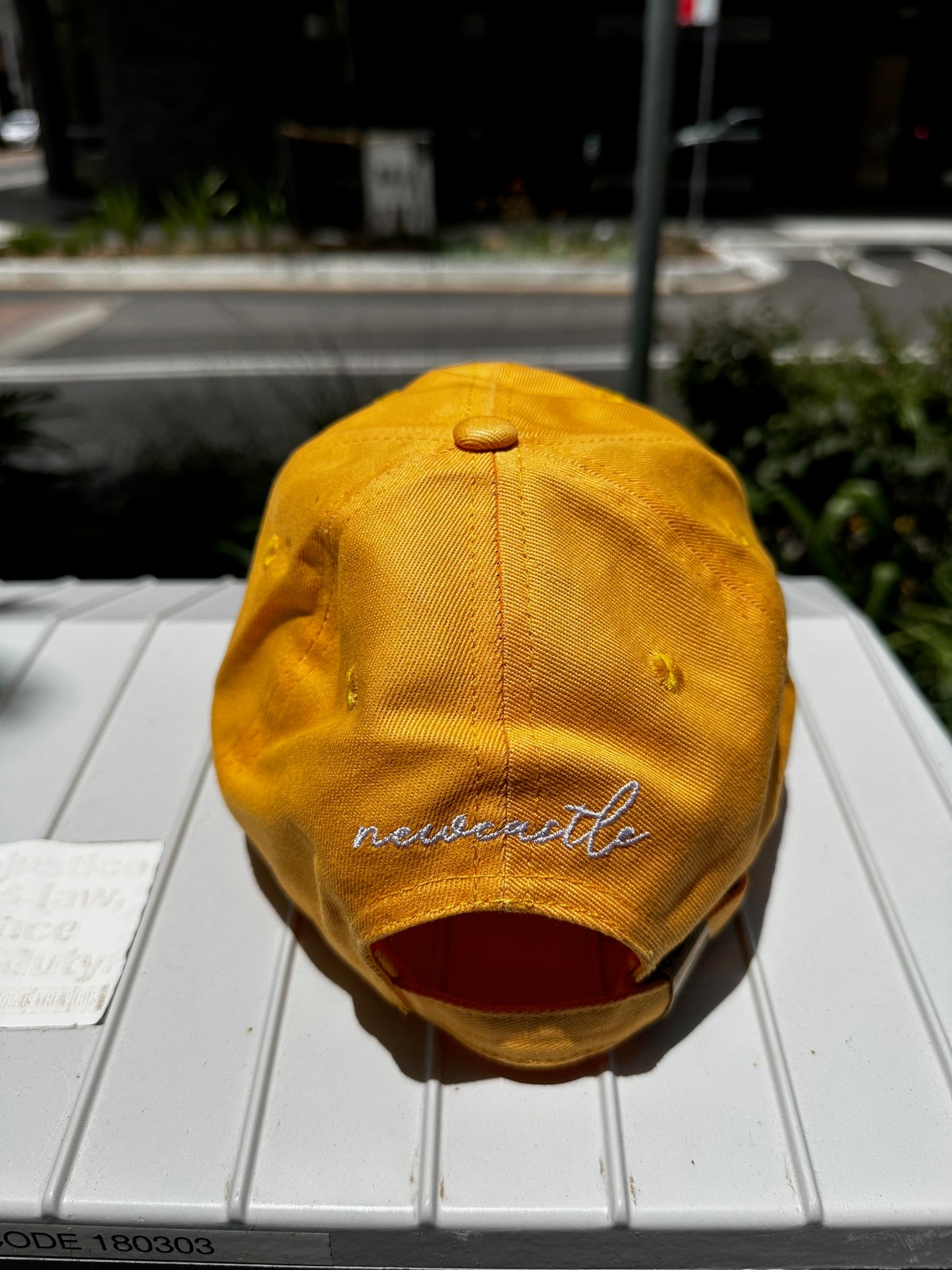 The Rake Logo Dad Cap in Amber Yellow