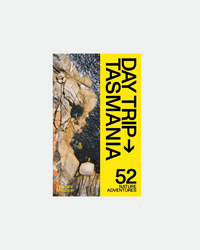 Cover of Day Trip Tasmania book showing maps and outdoor scenes of Tasmania's mountains, forests, beaches, and wildlife