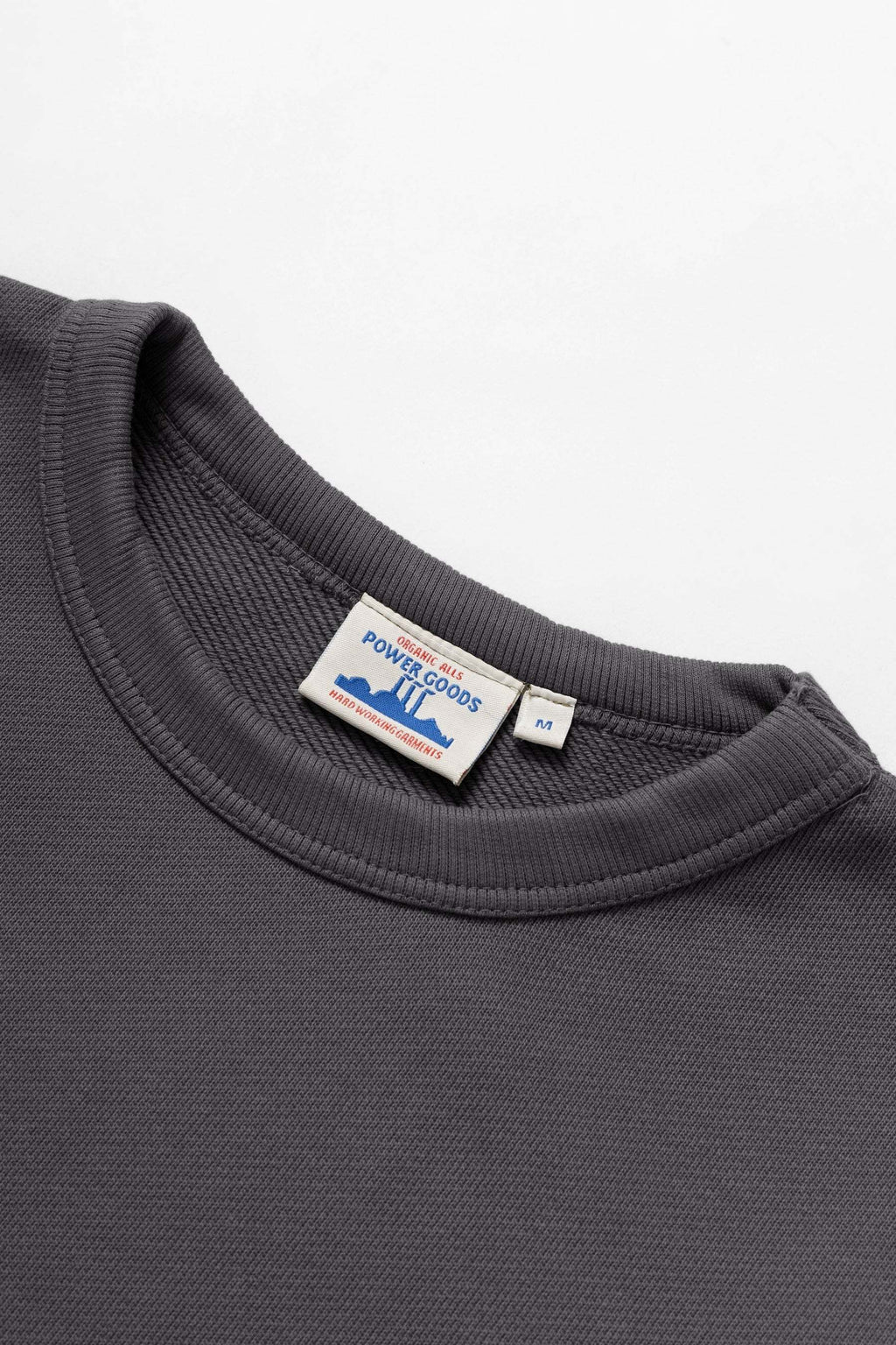Power Goods Loopback Crewneck in washed black organic cotton with crewneck and elasticated cuffs