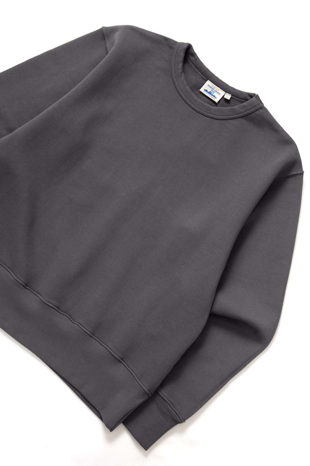 Power Goods Loopback Crewneck sweatshirt in washed black organic cotton with elasticated cuffs and crewneck design