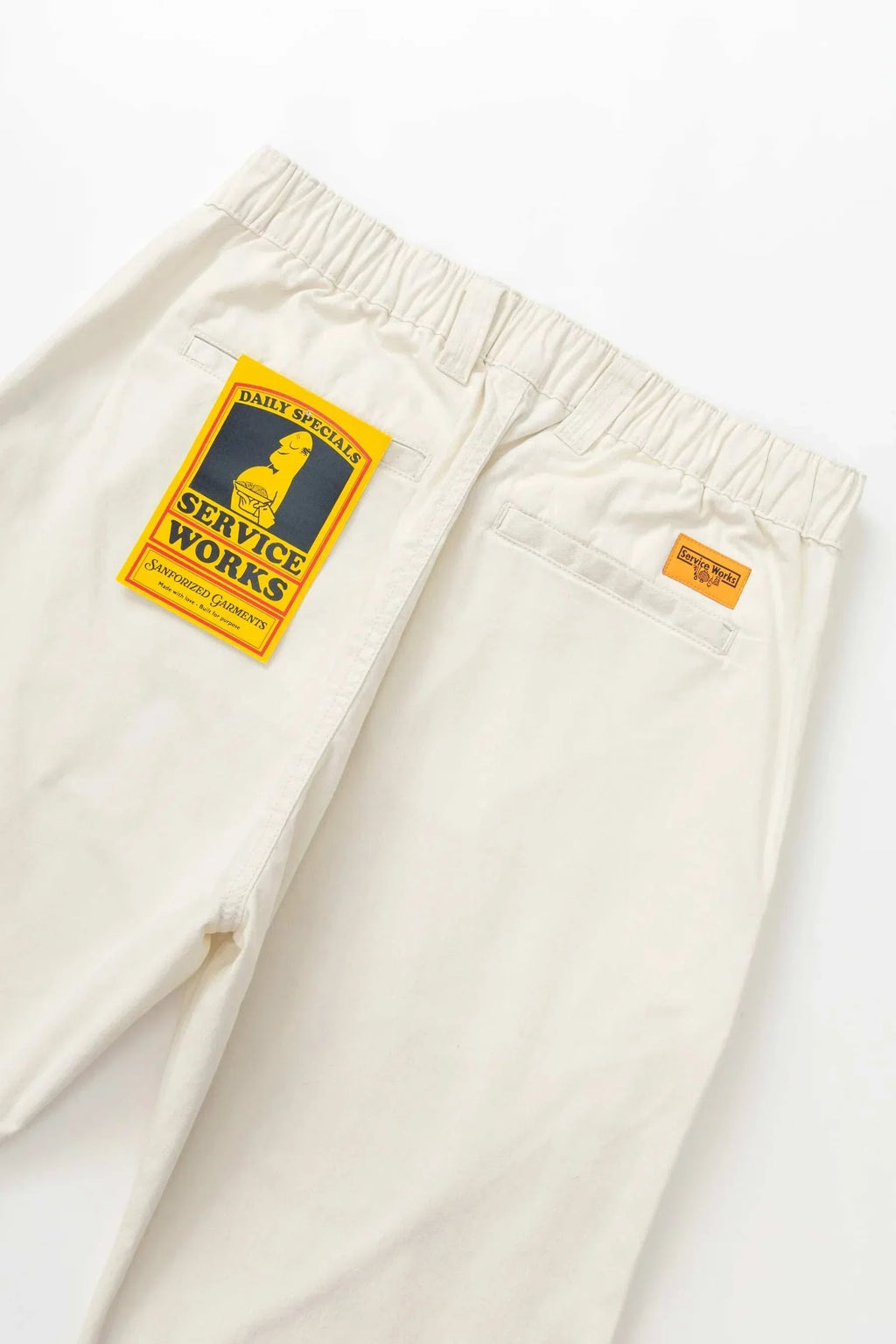Service Works Twill Waiter Pants in off white organic cotton twill with tapered leg and half-elastic waistband