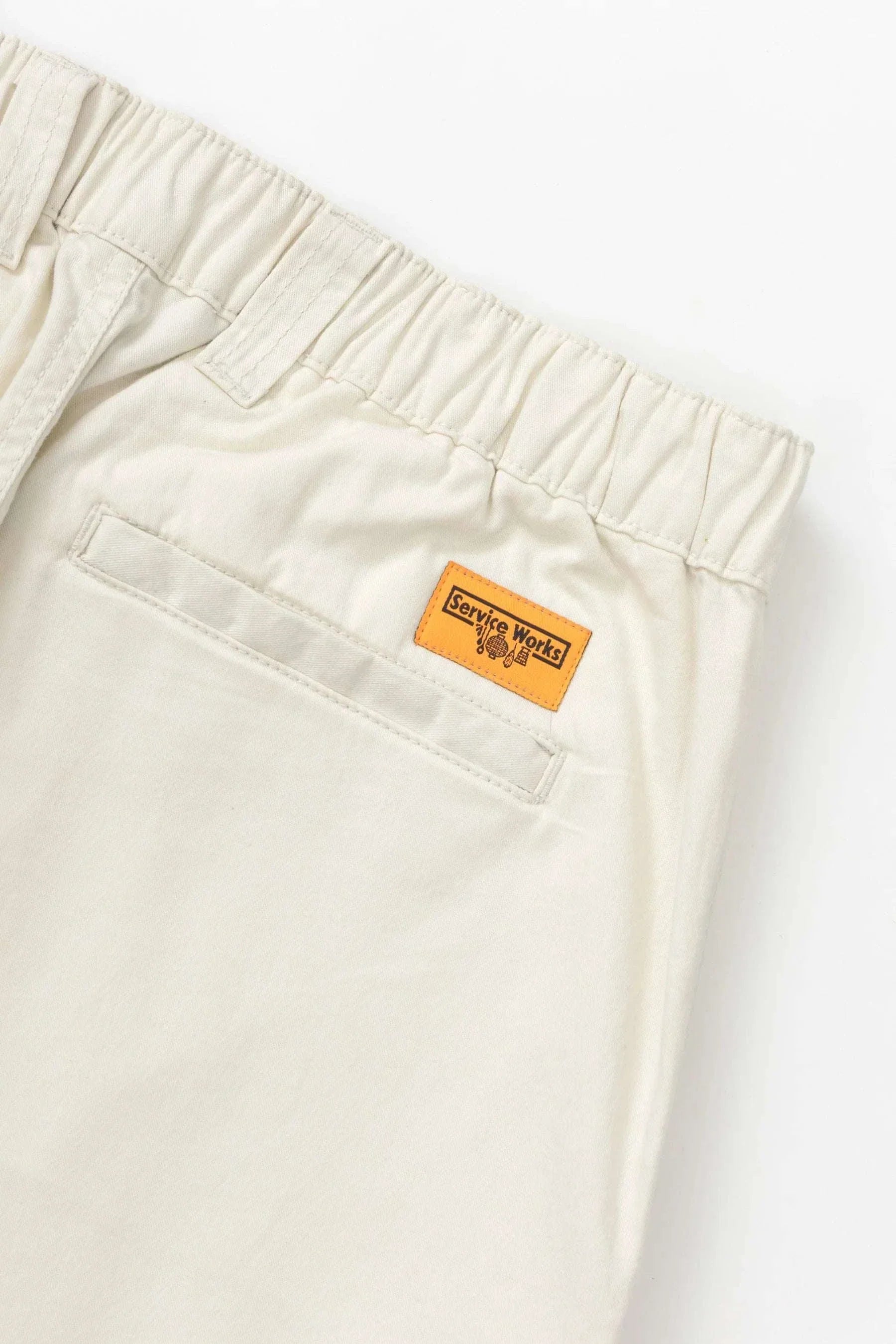 Service Works Twill Waiter Pants in off white with tapered ankle and half-elasticated waistband made from organic cotton twill