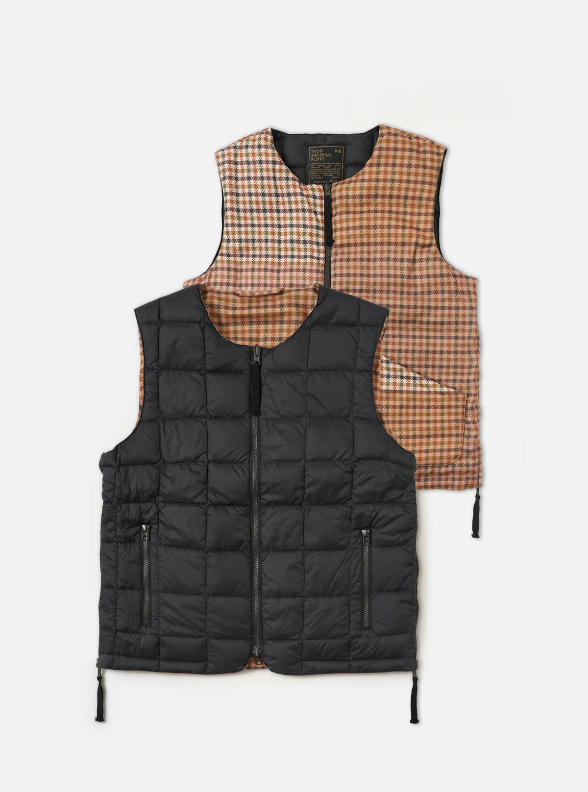 Black puffer vest with plaid lining on a white background