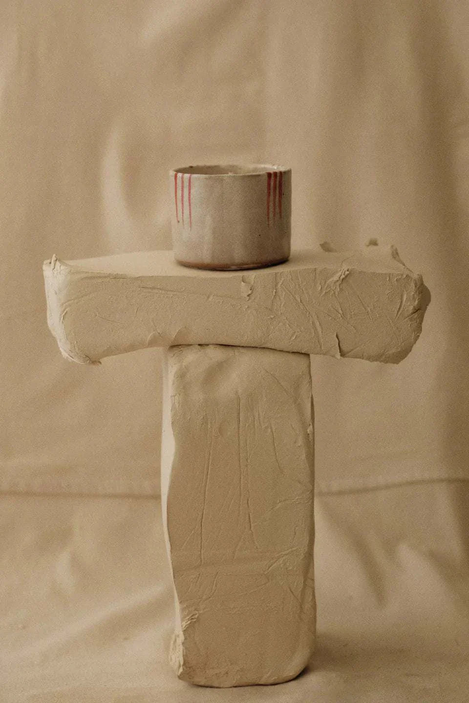 Provider Store Isla handmade Japanese ceramic candle with dusty pink glaze and red details